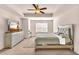 Spacious bedroom with a king-size bed, dresser, and ceiling fan at 5531 Pine Aly, Lithonia, GA 30058