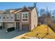 Two-story townhouse with a two-car garage and small yard at 5531 Pine Aly, Lithonia, GA 30058