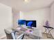 Bright home office features a large desk, two monitors, and ample workspace at 5531 Pine Aly, Lithonia, GA 30058