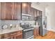 Kitchen with stainless steel appliances and wood cabinets at 5531 Pine Aly, Lithonia, GA 30058