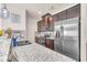 Spacious kitchen featuring granite counters and dark cabinets at 5531 Pine Aly, Lithonia, GA 30058