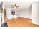 Bright and airy living room with hardwood floors and ceiling fan at 5531 Pine Aly, Lithonia, GA 30058