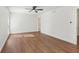 Bright bedroom featuring wood flooring and a ceiling fan at 622 Powers Ferry North Se, Marietta, GA 30067