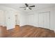 Bright bedroom with wood floors, ceiling fan, and ample closet space at 622 Powers Ferry North Se, Marietta, GA 30067