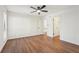 Spacious bedroom featuring wood floors and ceiling fan at 622 Powers Ferry North Se, Marietta, GA 30067