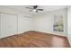 Well-lit bedroom with double closets and wood flooring at 622 Powers Ferry North Se, Marietta, GA 30067