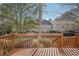 Spacious deck overlooking a private backyard with mature trees at 622 Powers Ferry North Se, Marietta, GA 30067