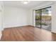 Dining area with wood floors and sliding glass doors to deck at 622 Powers Ferry North Se, Marietta, GA 30067