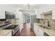 Updated kitchen with stainless steel appliances and granite countertops at 622 Powers Ferry North Se, Marietta, GA 30067