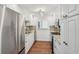 Modern kitchen with white cabinets and granite counters at 622 Powers Ferry North Se, Marietta, GA 30067