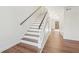 Clean, modern staircase with dark wood accents and white risers at 622 Powers Ferry North Se, Marietta, GA 30067