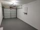 Garage with gray epoxy floor and water heater at 4664 Ryan Rd, Conley, GA 30288