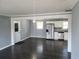 Open concept kitchen with stainless steel appliances and dark hardwood floors at 4664 Ryan Rd, Conley, GA 30288