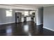 Modern kitchen featuring stainless steel appliances and dark hardwood floors at 4664 Ryan Rd, Conley, GA 30288