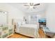 Bright bedroom with hardwood floors, ceiling fan, and a TV at 885 Briarcliff Ne Rd # 21, Atlanta, GA 30306