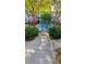The community pool is accessible through a secure gate with beautiful landscaping and trees for shade at 885 Briarcliff Ne Rd # 21, Atlanta, GA 30306