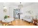 Bright dining area with kitchen view, white table, and floral bench at 885 Briarcliff Ne Rd # 21, Atlanta, GA 30306