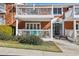 Charming brick building with white trim, balcony and porch with walkway to black-framed glass entry door at 885 Briarcliff Ne Rd # 21, Atlanta, GA 30306