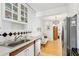 White kitchen with stainless steel appliances and view into living room at 885 Briarcliff Ne Rd # 21, Atlanta, GA 30306