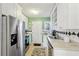 Well-equipped kitchen with stainless steel appliances and white cabinets at 885 Briarcliff Ne Rd # 21, Atlanta, GA 30306