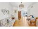 Light living room with hardwood floors, floral bench, and view to patio at 885 Briarcliff Ne Rd # 21, Atlanta, GA 30306