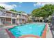 Community pool surrounded by brick condos with private balconies at 885 Briarcliff Ne Rd # 21, Atlanta, GA 30306