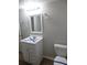Updated bathroom with white vanity and new toilet at 2491 Crestdale Se Cir, Atlanta, GA 30316