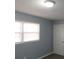 Bedroom with neutral walls and two windows with blinds at 2491 Crestdale Se Cir, Atlanta, GA 30316
