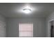 Hallway with neutral walls and a single window at 2491 Crestdale Se Cir, Atlanta, GA 30316