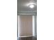 Living room with sliding door and blinds at 2491 Crestdale Se Cir, Atlanta, GA 30316