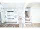 Bright hallway with built-in shelving and staircase at 3606 Columbia Pkwy, Decatur, GA 30034