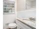 Clean bathroom with granite countertop and white tile at 226 Collum Nw St, Atlanta, GA 30314