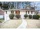 Charming ranch home with red door and well-manicured lawn at 226 Collum Nw St, Atlanta, GA 30314