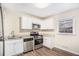 Updated kitchen, featuring stainless steel appliances and granite countertops at 226 Collum Nw St, Atlanta, GA 30314