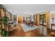 Formal dining room with brick floors, large windows, and a formal dining table at 23 Paces West, Atlanta, GA 30327