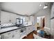 White kitchen with blue and white tile, gas range, and breakfast area at 23 Paces West, Atlanta, GA 30327