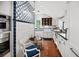 Charming kitchen with white cabinets, blue and white tile, and a breakfast nook at 23 Paces West, Atlanta, GA 30327