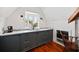 Charming kitchenette with marble countertop and dark cabinets at 23 Paces West, Atlanta, GA 30327