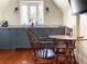 Small galley kitchen with blue cabinets and marble countertops at 23 Paces West, Atlanta, GA 30327