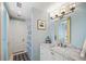 Bathroom with a white marble countertop, a geometric floor, and a shower door at 23 Paces West Dr, Atlanta, GA 30327