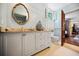 Bright bathroom featuring a double sink vanity with granite countertop, an ornate mirror, and a tiled floor at 23 Paces West Dr, Atlanta, GA 30327