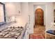 Charming kitchen with custom tiled backsplash, white cabinetry, and a glimpse of a brick-paved hallway at 23 Paces West Dr, Atlanta, GA 30327