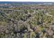 Aerial view showing home nestled in wooded area with suburban surroundings at 3251 Wanda Woods Dr, Atlanta, GA 30340