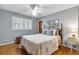 Cozy bedroom with a comfortable bed, hardwood floors, and a ceiling fan at 3251 Wanda Woods Dr, Atlanta, GA 30340