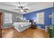 Bright bedroom with hardwood floors, blue accent wall, and ample natural light at 3251 Wanda Woods Dr, Atlanta, GA 30340