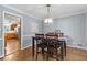 Dining room with hardwood floors and a chandelier at 3251 Wanda Woods Dr, Atlanta, GA 30340