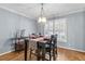 Dining room with hardwood floors and a chandelier at 3251 Wanda Woods Dr, Atlanta, GA 30340