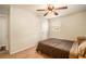 Cozy bedroom with a brown comforter and ceiling fan at 4163 Citizen Cir, Austell, GA 30106