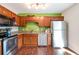 Modern kitchen featuring wood cabinets and stainless steel appliances at 4163 Citizen Cir, Austell, GA 30106