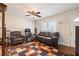 Living room with leather furniture, ceiling fan, and hardwood floors at 4163 Citizen Cir, Austell, GA 30106